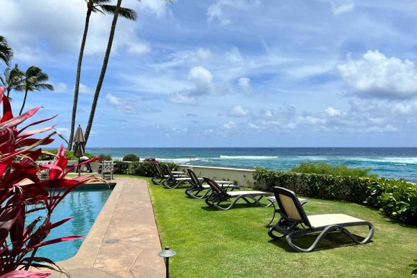 comfortable loungers by oceanfront heated pool