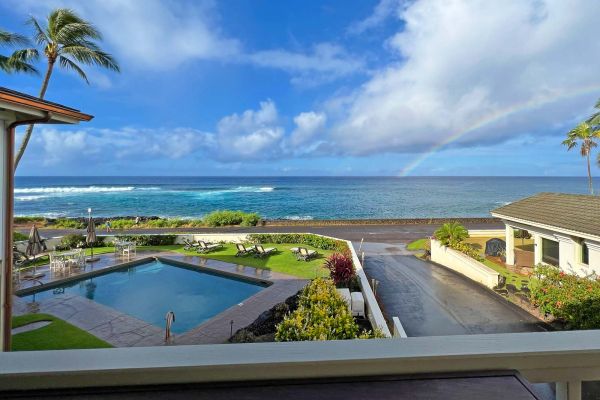 rainbow over the ocean seen from Alihi Lani 4 lanai after morning rain shower