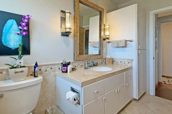 front bathroom with custom travertine tile