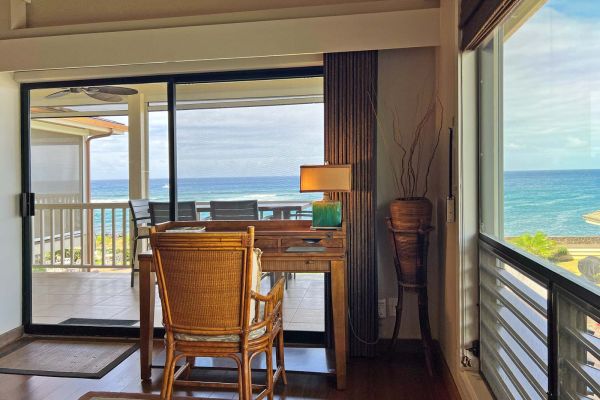 well-lit writing desk with ocean view and breezes